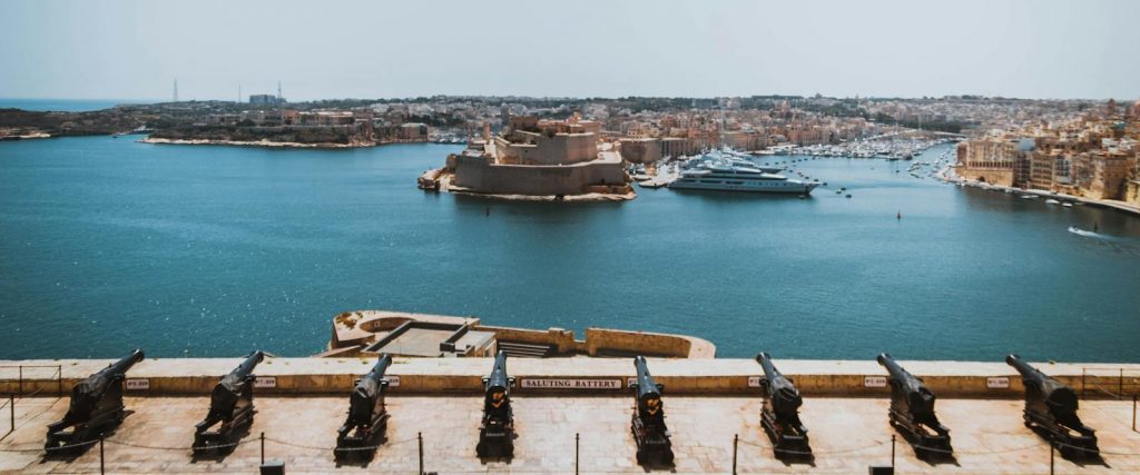 Stunning view of Valletta harbor and city from Saluting Battery on a sunny day.